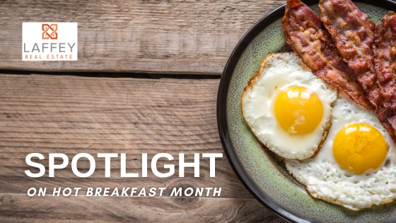 Close up of 2 sunny side up style eggs and bacon on a plate stock photo
